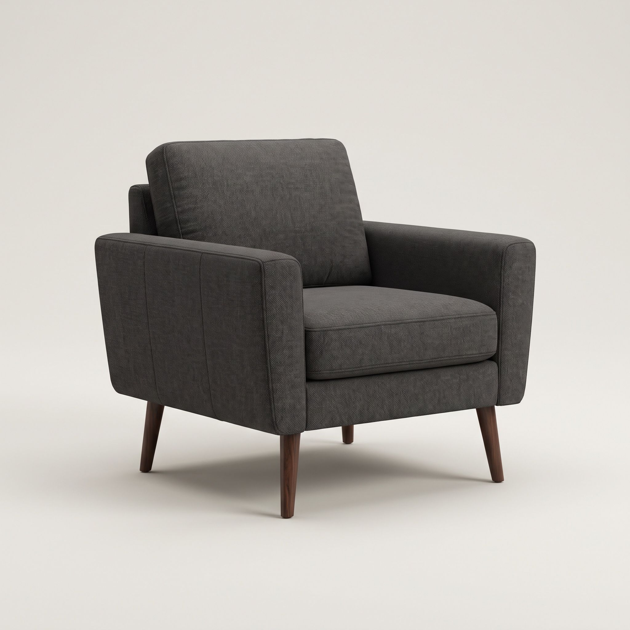 A charcoal upholstered armchair